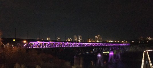 Edmonton High Level Bridge at night lit in purple